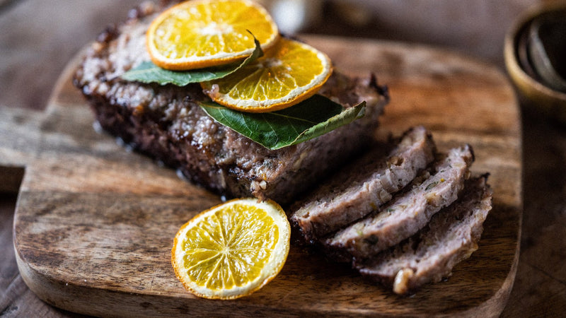 Cooked and Sliced Native Breed Pork Sausage Meat with Orange and Bay Leaves
