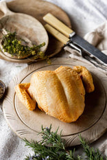 A raw, properly free range spatchcock chicken breast