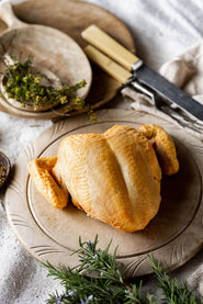A raw, properly free range spatchcock chicken breast