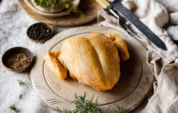 A raw, properly free range spatchcock chicken breast 