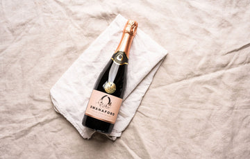 A bottle of Swanaford Brut Rosé sparkling pink wine.