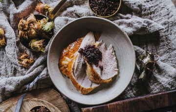 A cooked whole properly free range bronze turkey with cranberry sauce