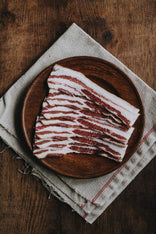 Traditionally Cured Unsmoked Streaky Bacon From Native Breed Pork, Perfect For Weekend Breakfasts.