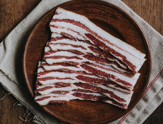Traditionally Cured Beechwood Smoked Streaky Bacon from native breed pork.
