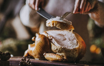 Carving a cooked whole properly free range bronze turkey
